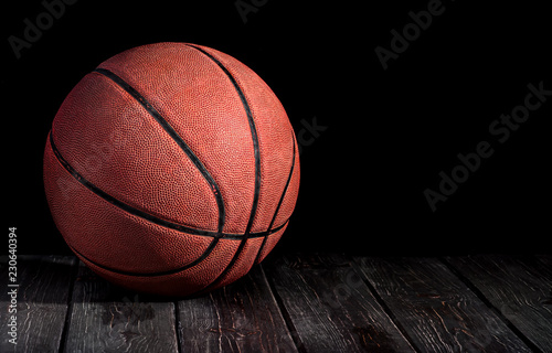 Basketball ball on a wooden floor