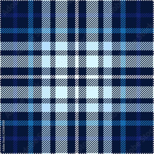 Plaid pattern in blue, navy, indigo and white. Seamless fabric texture.