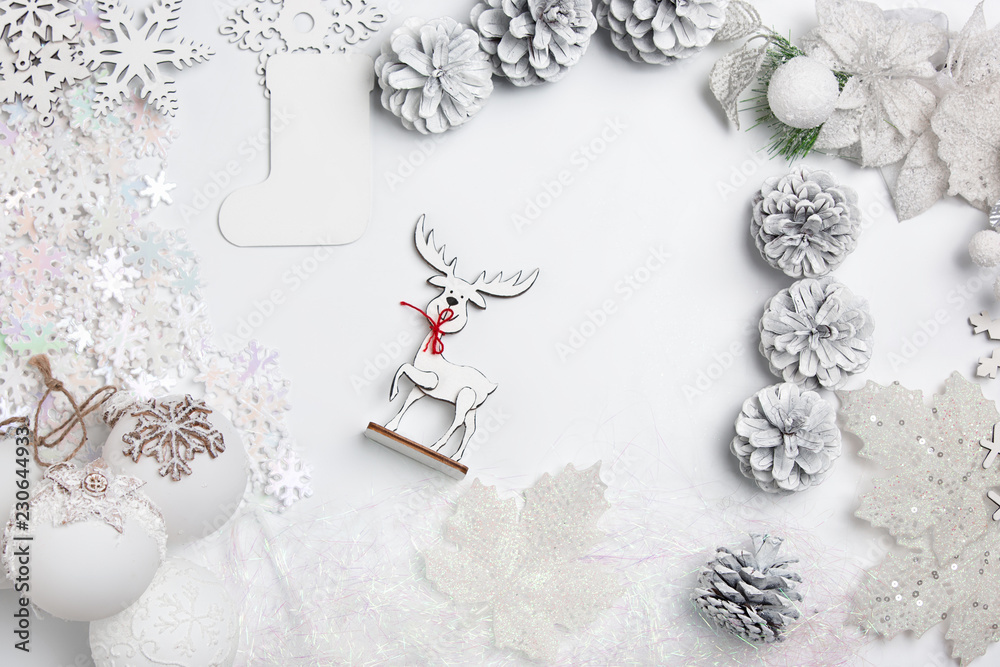 Christmas decorative composition of toys on a white table background. Top view. Flat Lay Christmas decorative composition of toys on a white table background. Top view. Flat Lay