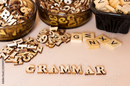 wooden letters forming grammar text