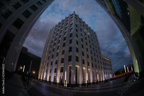 modern office buildings night with sunset light fisheye