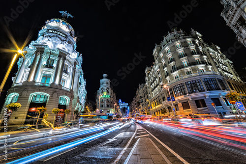 The famous shopping district of Madrid, the Gran Via, lit up at night