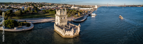 Aerial drone photo of the  Belem Tower (Belém Tower) at sunset.  A medieval castle fortification on the Tagus river of Lisbon Portugal photo
