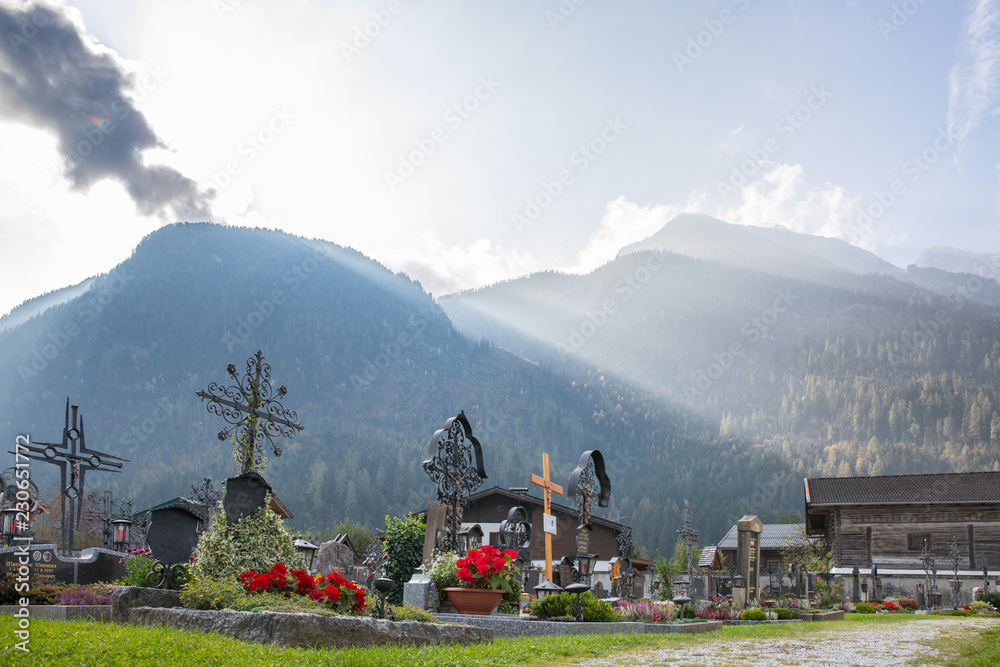 Cemetery, moutains and light rays in the background