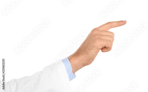 Male doctor pointing on white background, closeup