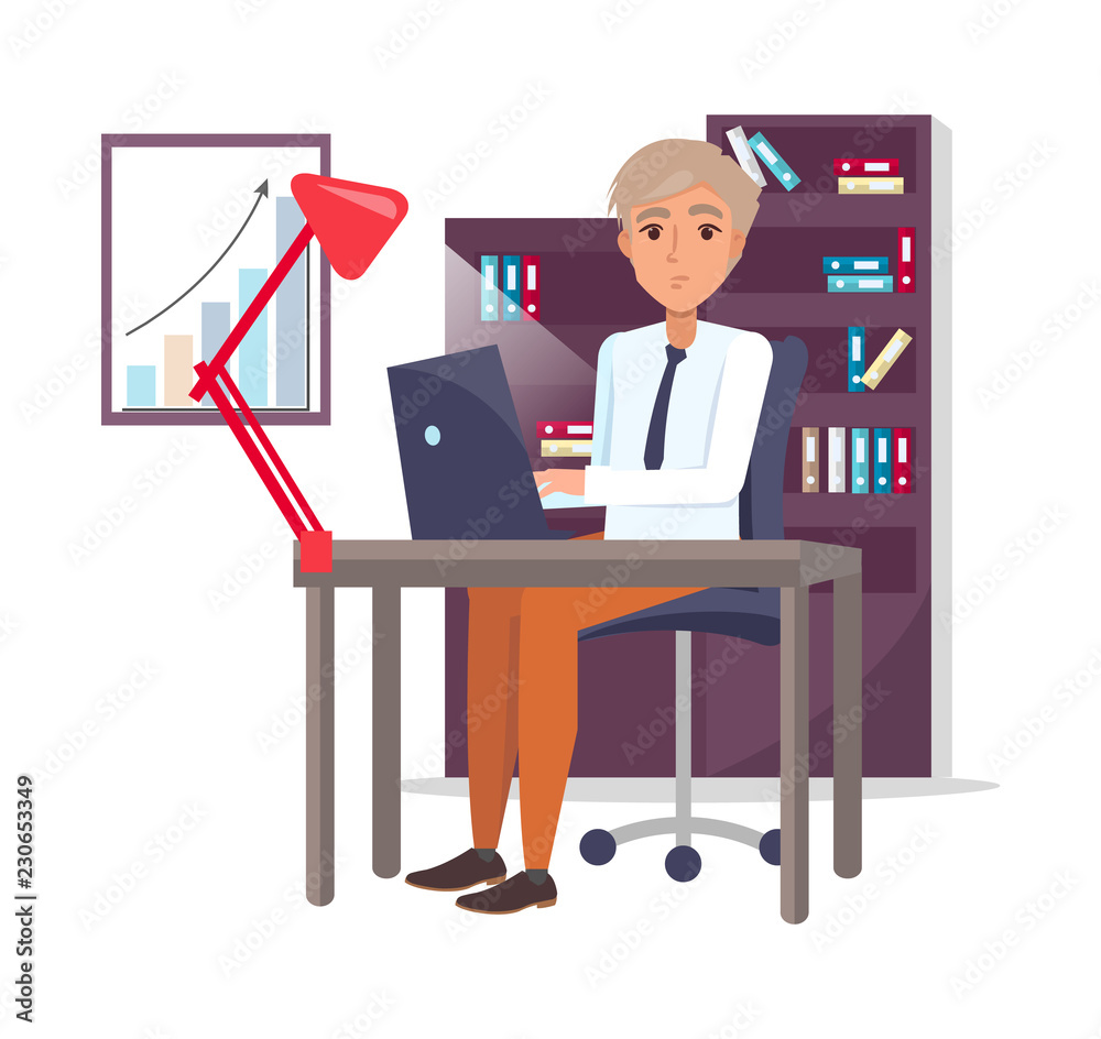 Male Sitting at Workplace and Typing on Laptop.