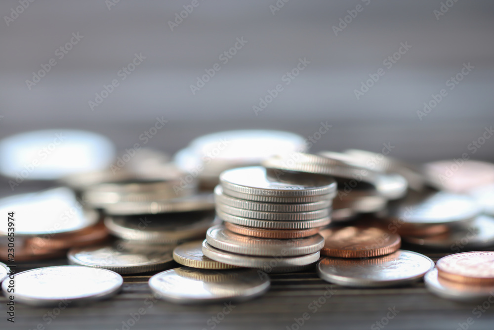 Row of coins on wood background for finance and Saving concept,Investment, Economy, Soft focus and dark style. Row of coins on wood background for finance and Saving concept,Investment, Economy, Soft focus and dark style.