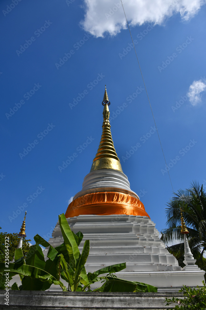 Fototapeta premium The tip of a Chedi in a Wat 