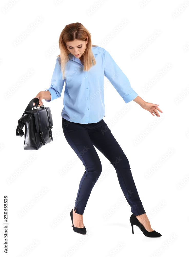 Full length portrait of businesswoman with briefcase balancing on white background Full length portrait of businesswoman with briefcase balancing on white background