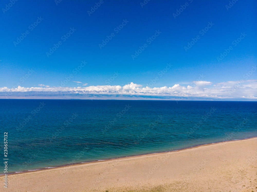 The Issyk-kul Lake. Kyrgyzstan, Central Asia. Dron Arial Shoot. The Issyk-kul Lake. Kyrgyzstan, Central Asia. Dron Arial Shoot.