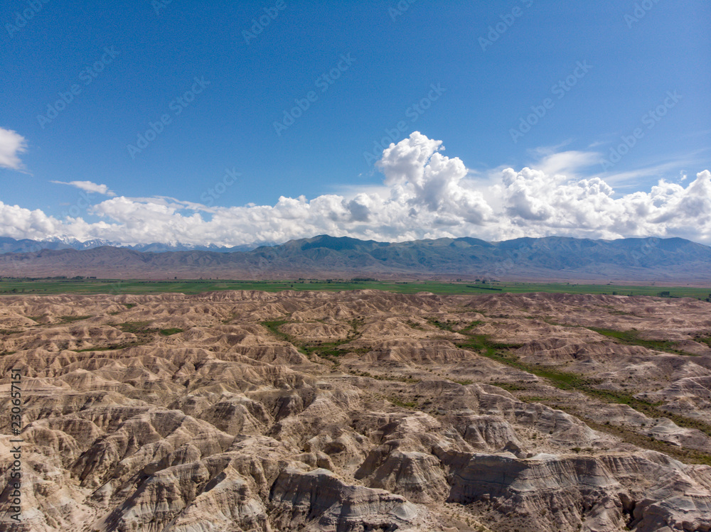 Colourful Red Rock Formations of Skazka (Fairy Tale) Canyon. Issyk-kul Lake Kyrgyzstan Central Asia. Dron Arial Shoot.