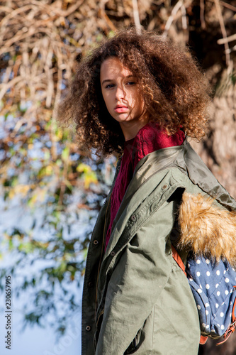 Teen girl in autumn park