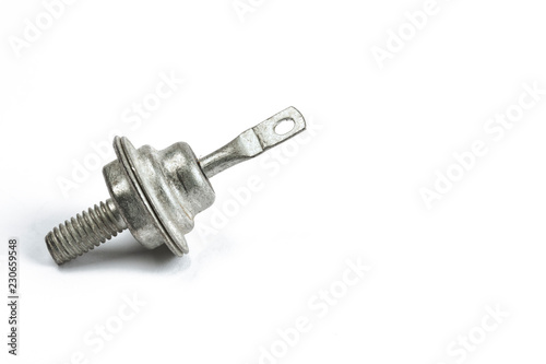 Radio element, a very old diode close-up, on a white background. © Oleg