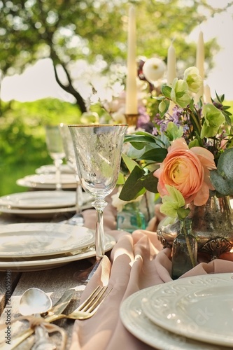 wedding decorated table, decor wedding dinner in nature in the garden