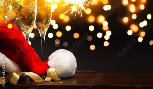 Christmas and happy New year party background; champagne and Santa hat