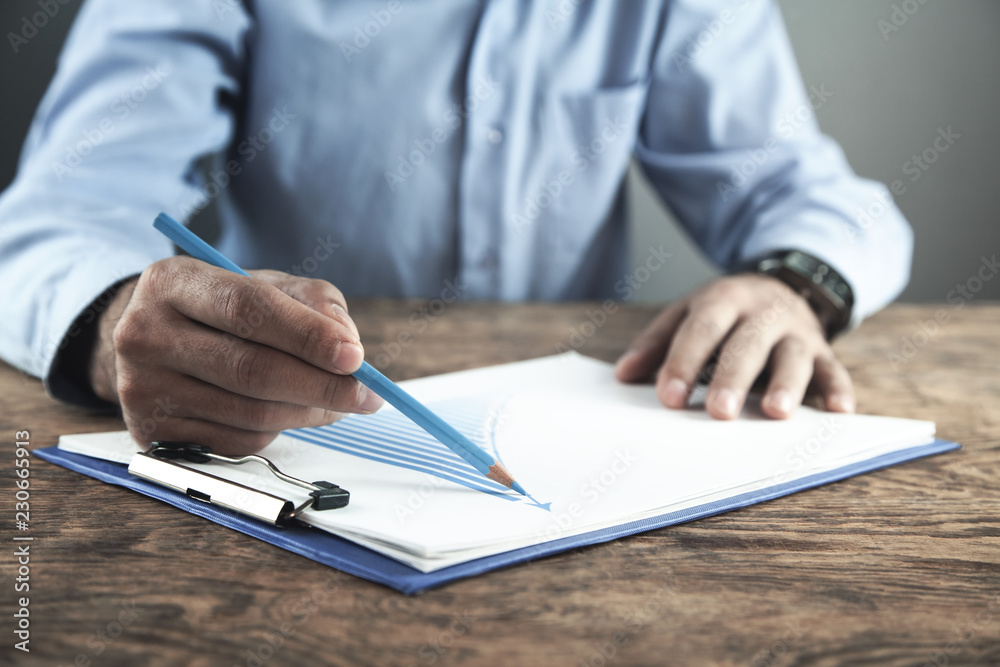 Businessman draws a graph of growth. Business concept Businessman draws a graph of growth. Business concept