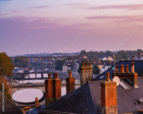 Scenes from Laval France along the Mayenne river with castles and churches