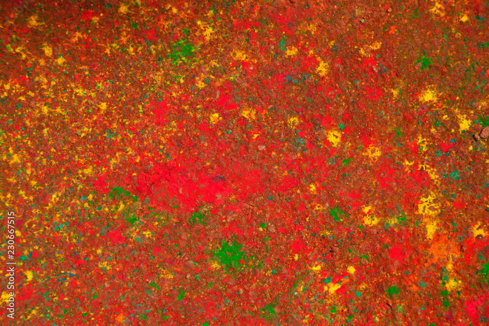 An abstract red bright background on the asphalt after the Spring Festival of colors. Holiday and joy concept. An abstract red bright background on the asphalt after the Spring Festival of colors. Holiday and joy concept.