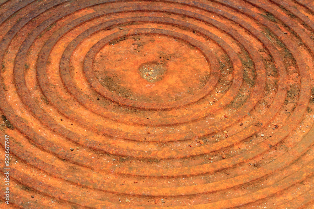 Old rust metal of cover drain hose for texture or background. Close-up texture of rusty metal of pipe cover or drain hose for creative design concept Old rust metal of cover drain hose for texture or background. Close-up texture of rusty metal of pipe cover or drain hose for creative design concept