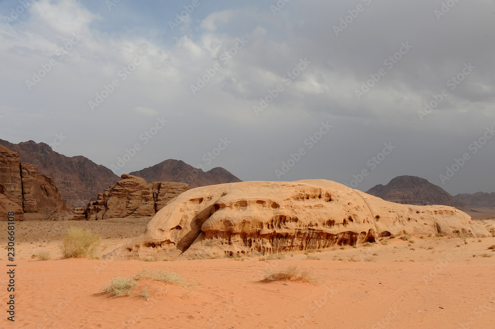 Jordanian desert in Wadi Rum, Jordan. Wadi Rum has led to its designation as a UNESCO World Heritage Site. It is known as The Valley of the Moon Jordanian desert in Wadi Rum, Jordan. Wadi Rum has led to its designation as a UNESCO World Heritage Site. It is known as The Valley of the Moon
