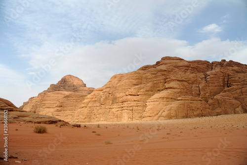  Jordanian desert in Wadi Rum, Jordan. Wadi Rum has led to its designation as a UNESCO World Heritage Site. It is known as The Valley of the Moon