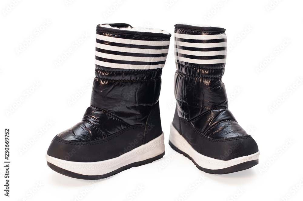 Black boots for children are isolated on a white background. In these boots the child will be warm in the winter Black boots for children are isolated on a white background. In these boots the child will be warm in the winter