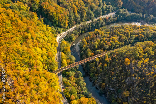 Jiului Valley (Valea Jiului) Canyon panorama with mountain road trough the forest aerial view