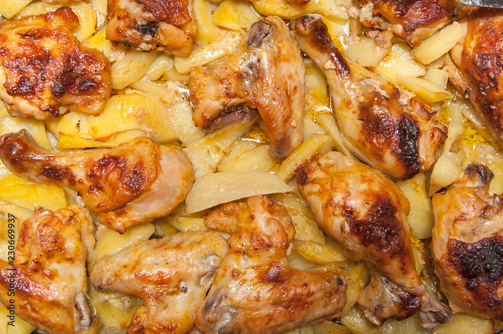 Fried chicken legs and wings and fried potatoes cooked at home Fried chicken legs and wings and fried potatoes cooked at home