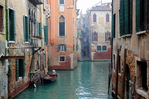 The canal in Venice. Ancient buildings, bridges, boats, reflections in the water © Oksana Shkrebka
