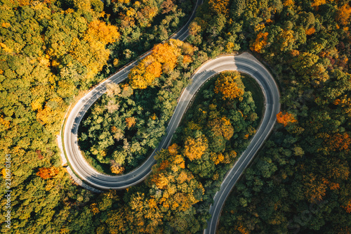 Extreme winding road in sunset light. Aerial view.