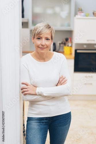 Attractive self-assured woman in her apartment