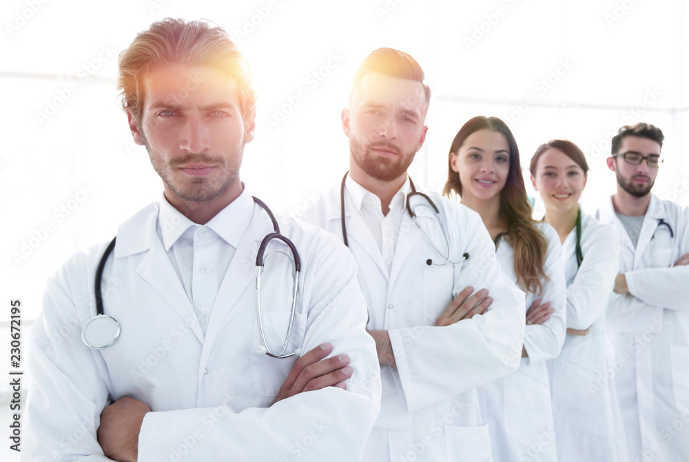 Portrait of medical team standing with arms crossed in hospital Portrait of medical team standing with arms crossed in hospital