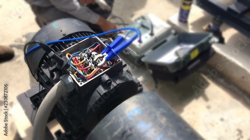 Hand close up of Engineer to check motor winding by insulation tester