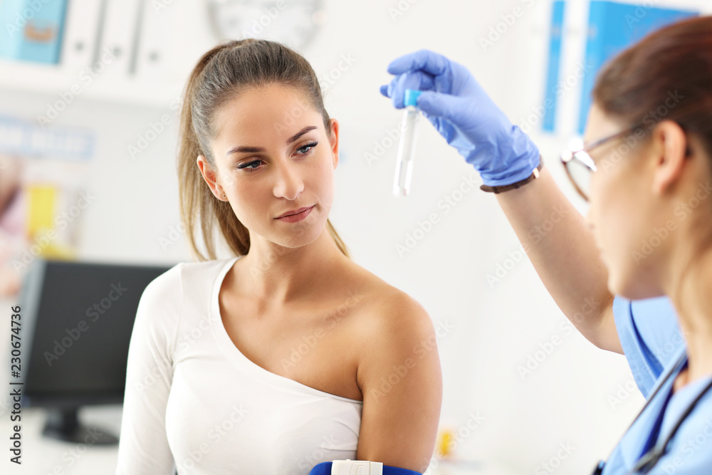 Adult woman having blood collection visit at female doctor's office Adult woman having blood collection visit at female doctor's office