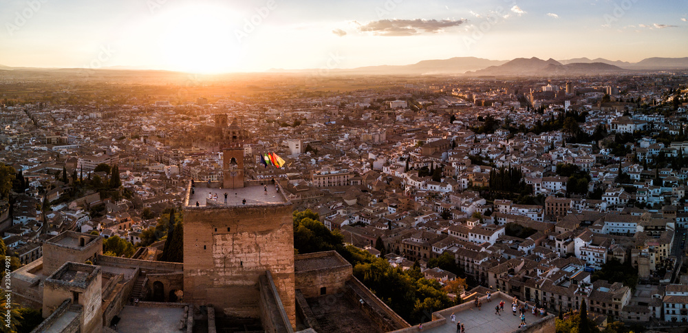 Aerial drone photo above The Alhambra Palace of Granada Spain at sunset.  