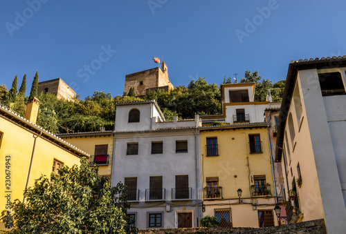Royal Alhambra Palace above a neighborhood in Granada, Spain © nick