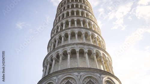 Tilt up view of Leaning tower of Pisa Italy Tourists attraction UNESCO Travel destination Evening sun Sunset 