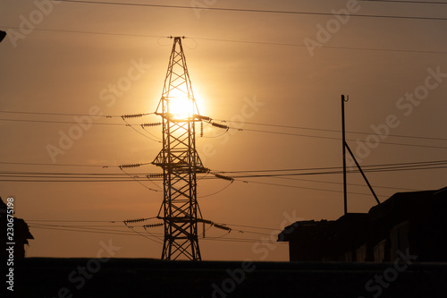 Silhouette of high voltage post. Norilsk.