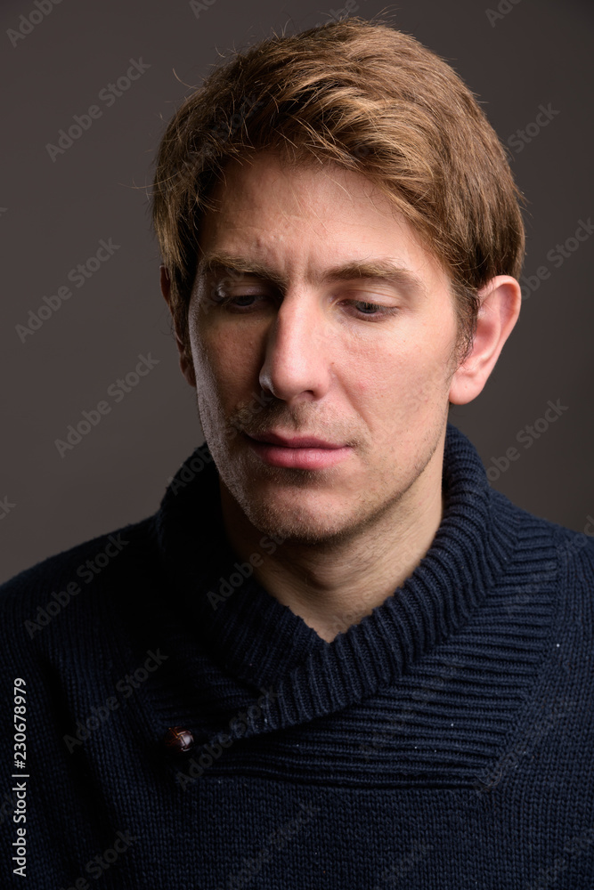 Portrait of handsome man against gray background Portrait of handsome man against gray background