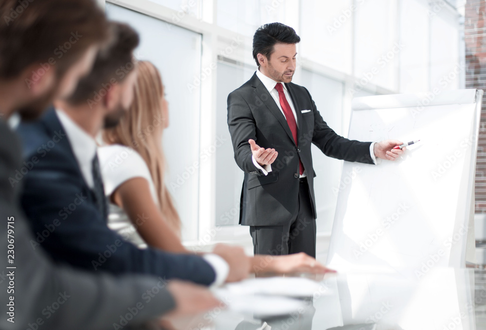 team leader giving presentation to his business colleagues team leader giving presentation to his business colleagues