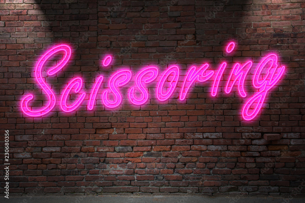 Obraz premium Scissoring Neon Lettering on Brick Wall