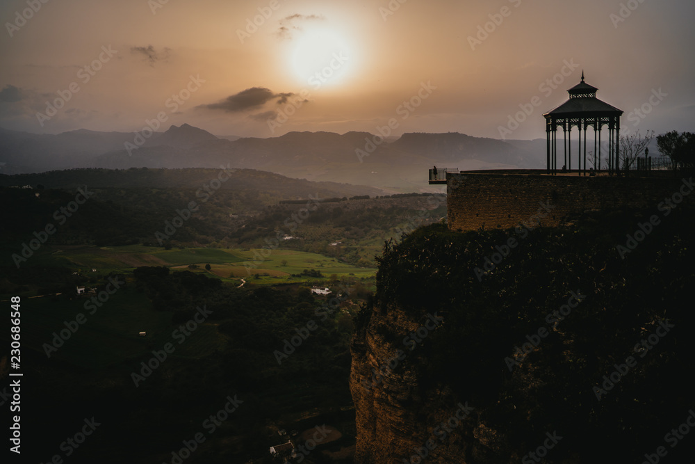 Person in a Pavillion standing at cliff of Ronda