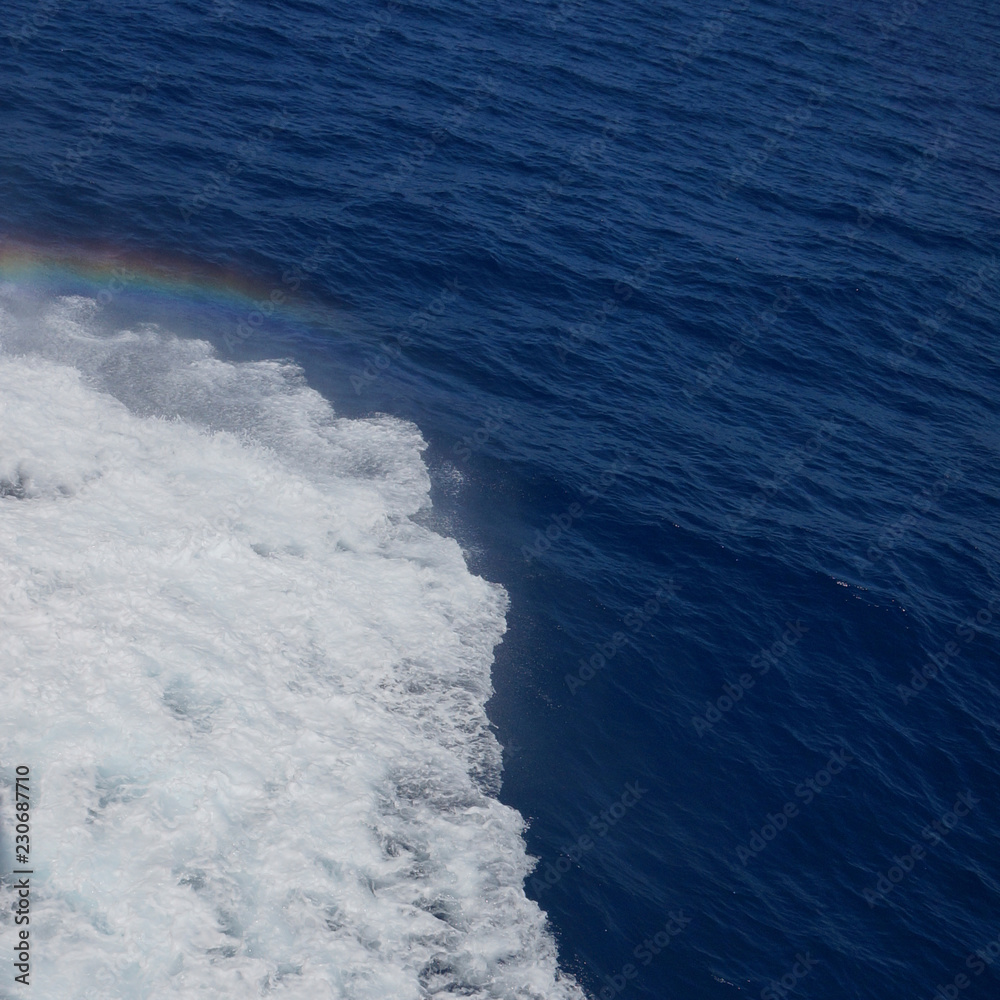 sea waves foam rainbow