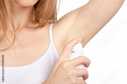 Beautiful young woman armpit deodorant on white background isolation © Kabardins photo