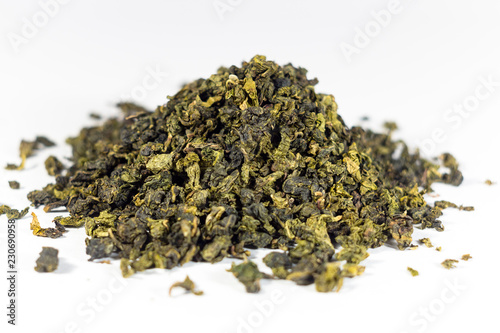 Heap of rolled green Oolong tea isolated on white background (with shallow depth of field)
