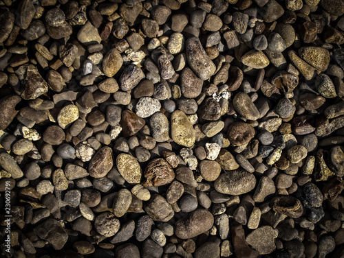 the texture of small light and dark stone pebbles