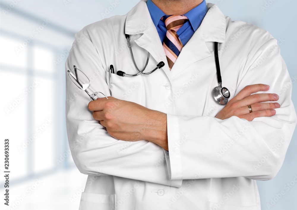 Smiling medical doctor with stethoscope. Isolated over Smiling medical doctor with stethoscope. Isolated over