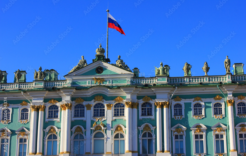 Winter Palace Building at Palace Square in Saint Petersburg, Russia. Facade Architecture of Old Historical City Landmark with Russian Flag on Sunny Day at Main Square of St. Petersburg City