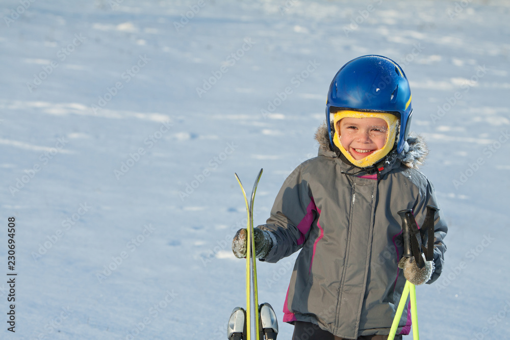 Little boy is having fun while skiing