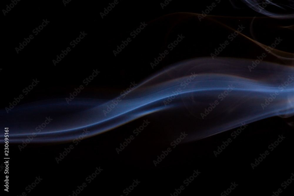 Thick smoke on a black isolated background. Background from the smoke of vape Thick smoke on a black isolated background. Background from the smoke of vape